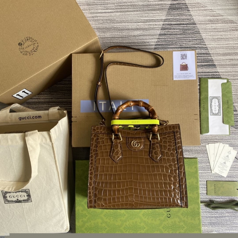 G*u*i top handle bags